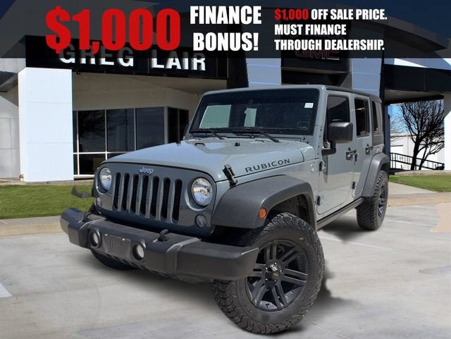 2015 Jeep Wrangler Unlimited Rubicon in Gray — front three-quarter view