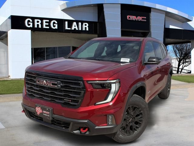 2026 GMC Acadia AT4 in Volcanic Red Tintcoat — front three-quarter view