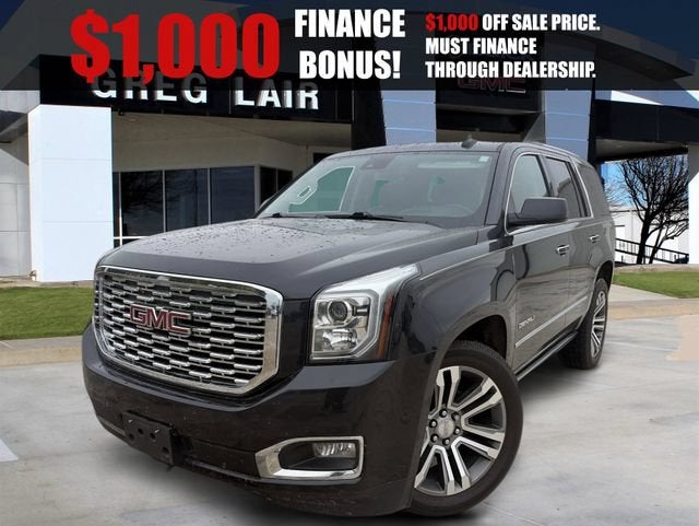 2020 GMC Yukon Denali in Carbon Black Metallic — front three-quarter view