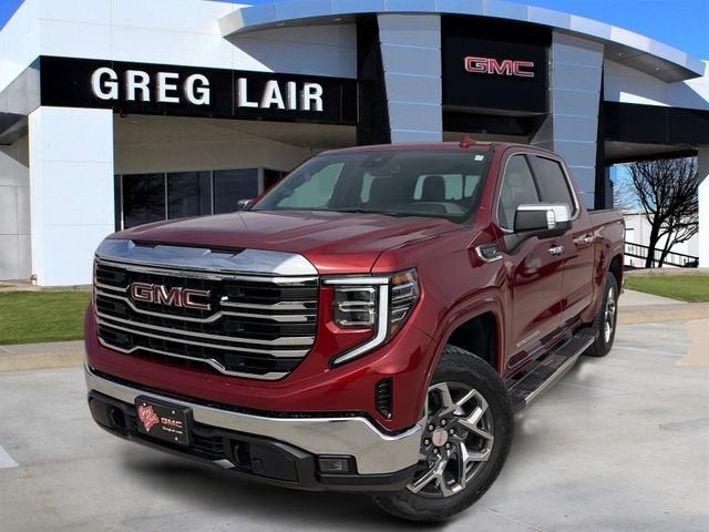 2026 GMC Sierra 1500 SLT in Volcanic Red Tintcoat — front three-quarter view